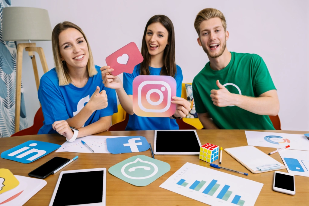 woman-holding-snapchat-logo-with-his-friends-showing-thumbup-sign